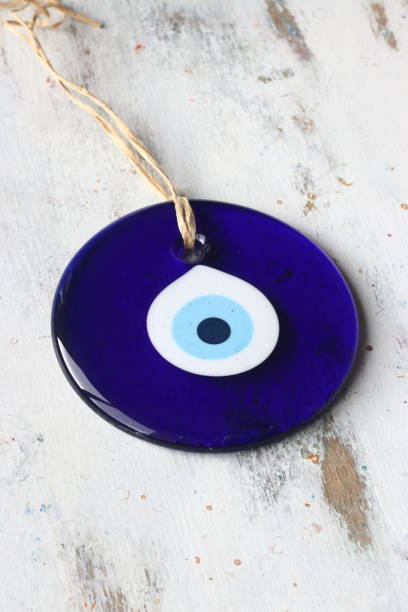 istock Evil eye bead, Turkish nazar bead on a white wooden background 1170889778