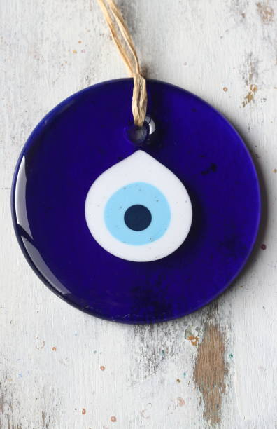 istock Evil eye bead, Turkish nazar bead on a white wooden background 1170889830
