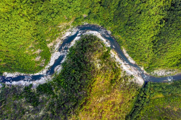 istock Aerial top-down view of a river crossing mountain range 1170894828