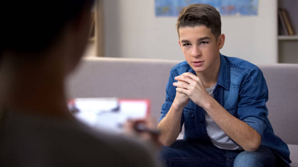 istock Anxious teenager visiting psychologist for personal therapy session, problems 1170895972