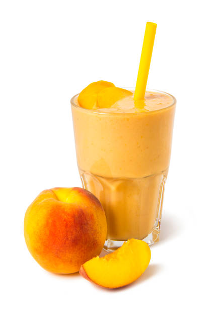 istock Peach smoothies in a glass with fresh fruits on a white background 1170896016