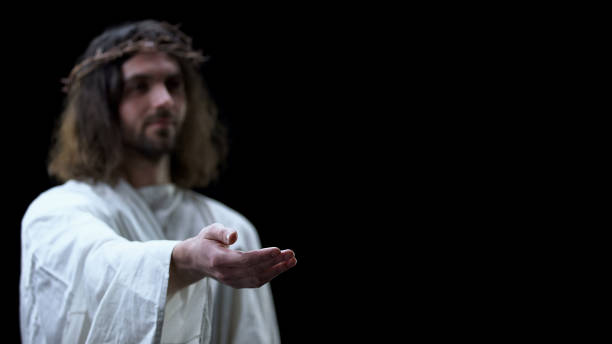 istock Jesus Christ white cloth stretching out hand, religious support, peace in heaven 1170896404
