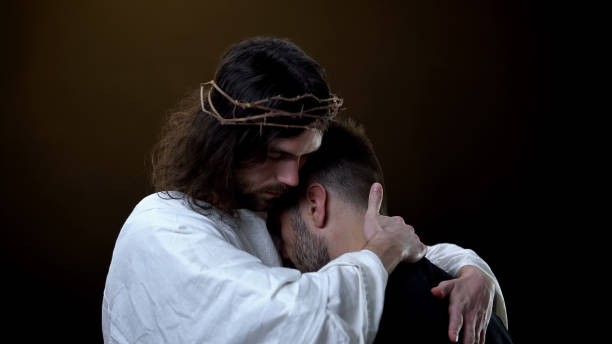 istock Savior in crown of thrones hugging desperate male, religious peace, forgiveness 1170896485