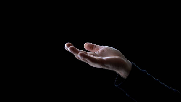istock Male hand asking for help on dark background, begging for donation, poverty 1170896620