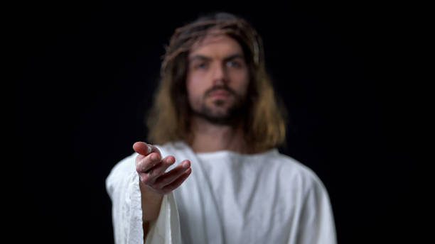 istock Christ stretching out hand looking camera, life in heaven, miracle, support 1170897011