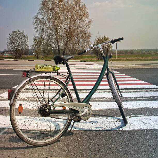 istock Bicycle on the road against the beautiful sky 1170900793