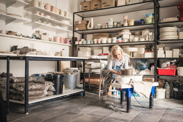 istock Female artist working on potters wheel 1170900810