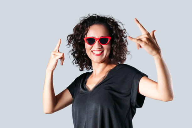 Happiness woman showing rock gesture