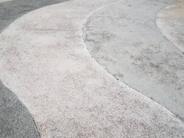 istock white and grey curved cement sidewalk or ground 1170902236