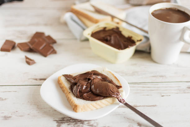 istock Delicious toast bread with chocolate paste on plate closeup. 1170902566