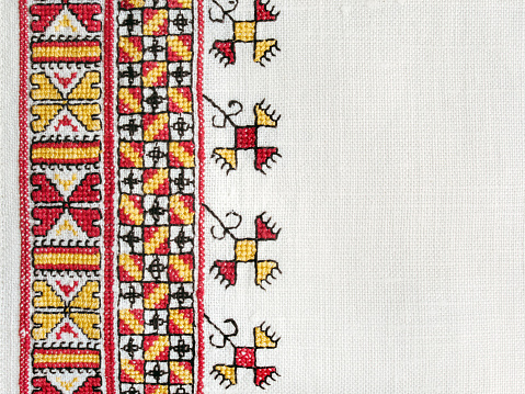 Ukrainian national hand cross-stitch embroidery on white homespun linen