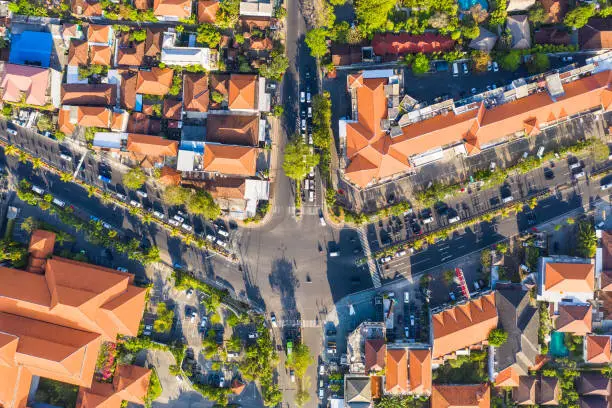 Top down view of a crowded road intersection in the Sanur area of the Denpasar city in Bali, Indonesia