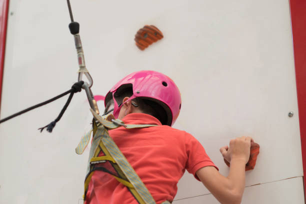 istock Happy boy on a climbing wall 1170904731