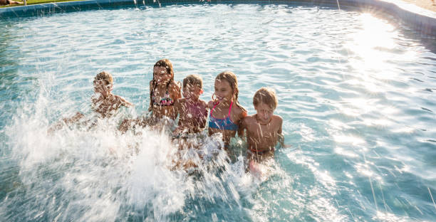 istock Group of children enjoying splashing 1170907313