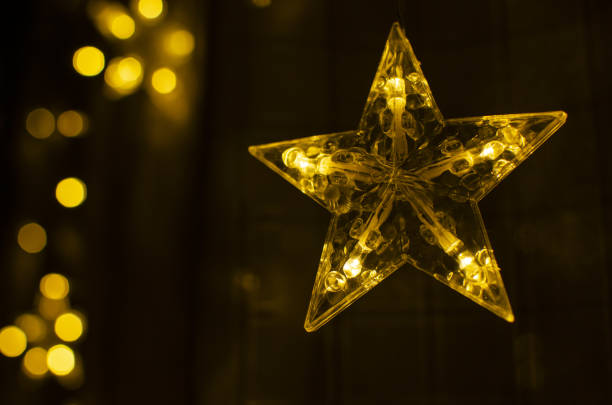 istock Festive glowing lights are on a dark background 1170909206