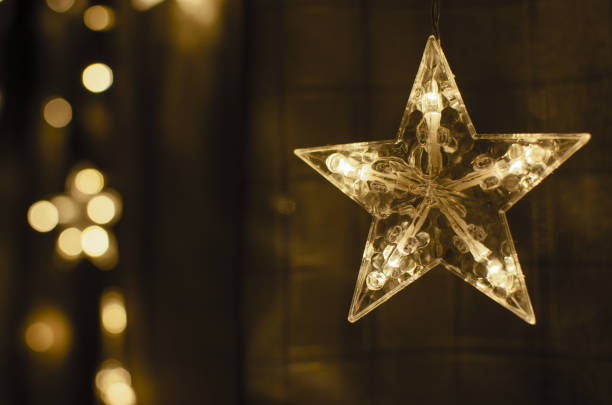 istock Festive glowing lights are on a dark background 1170909229