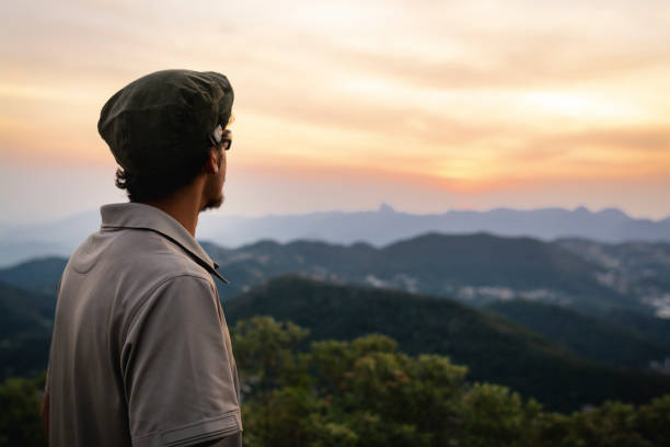 istock Young man on top of the mountain 1170910669