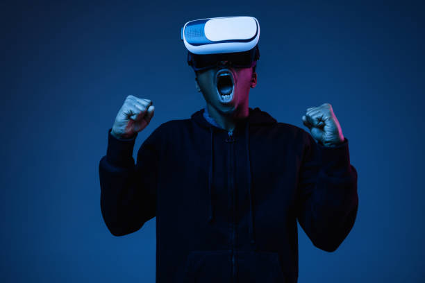 istock Young african-american man's using VR-glasses in neon light 1170912314
