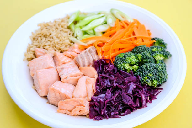 Fresh Healthy Salmon Poke Bowl With Broccoli, Carrots, Wholegrain Rice