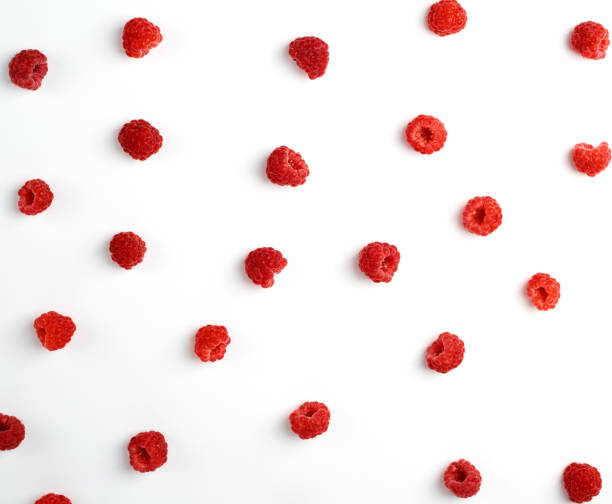 istock red ripe raspberries scattered on a white background, top view 1170915640