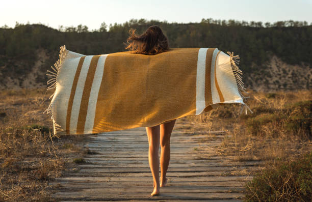 istock Beautiful woman wrapped in a wool towel 1170916901
