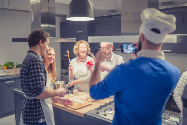 istock Chef is photographing attendees of cooking class 1170919385
