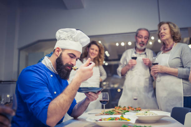 istock Chef is evaluating meals attendees of cooking class prepared 1170919442