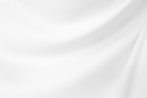 Primer plano elegante arrugado de tela de seda blanca fondo y textura. Diseño de fondo de lujo.-Imagen. photo