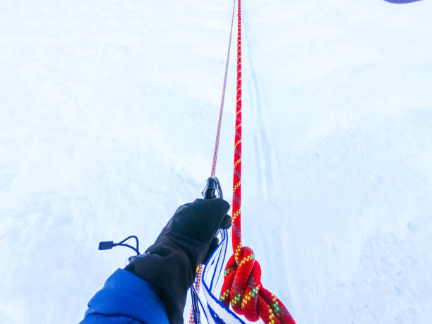 Denali National Park, Healy, Alaska, USA - June 24 2019: Denali is the tallest mountain in North America. Mountaineer / man climbing Denali while tethered on rope. This location is between 14,000 ft camp and high camp.