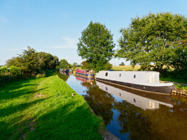 istock Moored barges reflected in the Shropshire Union Canal 1170921424