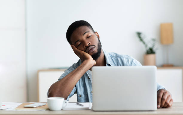 istock Exhausted African American worker felt asleep at workplace 1170924674