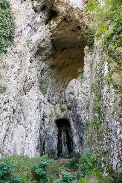 istock the entrance into the cave 1170925111