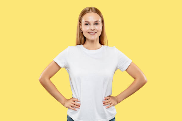 istock Caucasian young woman's half-length portrait on yellow background 1170925252