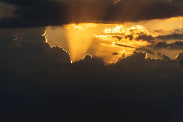 Stormy dramatic sky background with yellow red and orange clouds. Sunset skyline. Storm on the beach