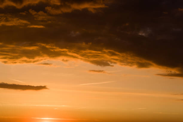 istock Stormy dramatic sky background with yellow red and orange clouds. Sunset skyline. Storm on the beach 1170926677