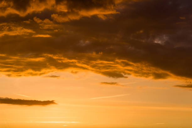 istock Stormy dramatic sky background with yellow red and orange clouds. Sunset skyline. Storm on the beach 1170926702