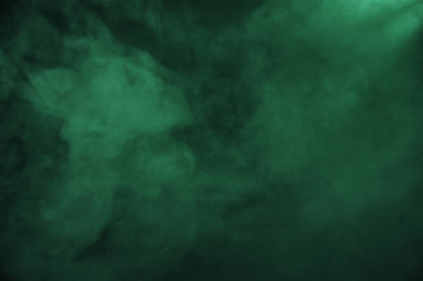 istock Green smoke on the dark background 1170926935