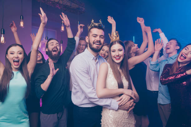 Portrait of crazy candid people mates shout raise hands wear stylish trendy formalwear dress suit disco discotheque Portrait of crazy candid people mates shout raise hands wear stylish trendy formalwear dress suit disco discotheque prom queen stock pictures, royalty-free photos & images