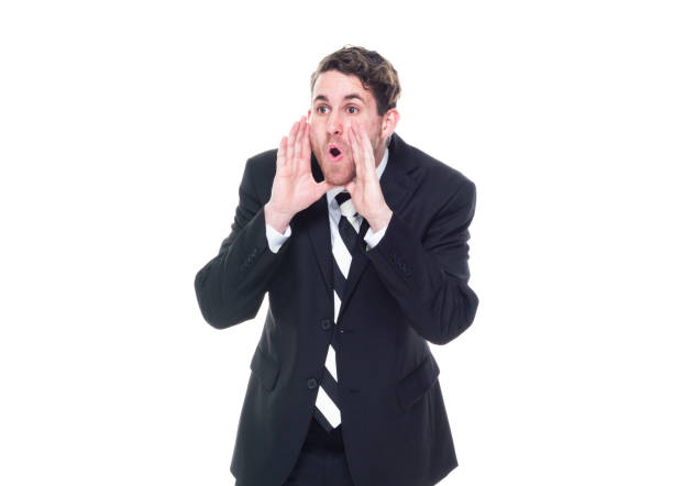 istock Good looking young businessman standing on white background - shouting 1170929906