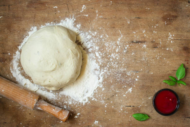 istock dough raw, flour, rolling pin for rolling (preparation for cooking) menu concept. food background. copy space 1170930326