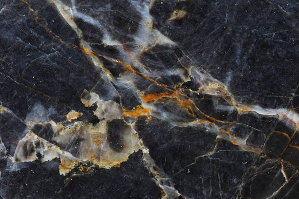 istock Gold and white patterned natural of dark gray marble pattern for interior design. 1170930426