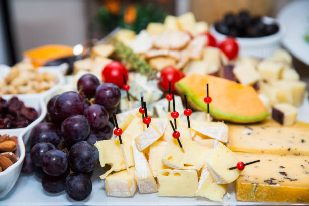 istock bites of fresh fruit, cheese and nuts 1170930514