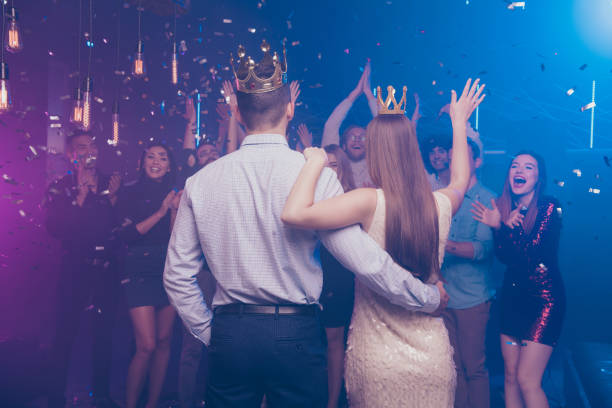 Back side view portrait of lovers have become king queen celebrating scream buddies enjoy dance floor Back side view portrait of lovers have become king queen celebrating scream buddies enjoy dance floor prom stock pictures, royalty-free photos & images