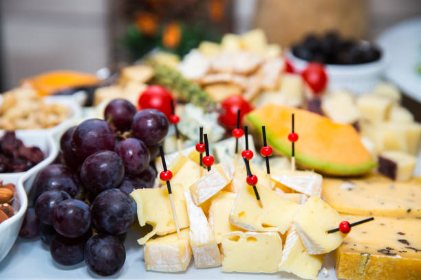 istock bites of fresh fruit, cheese and nuts 1170931122