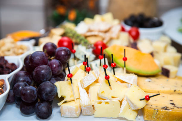 istock bites of fresh fruit, cheese and nuts 1170931209