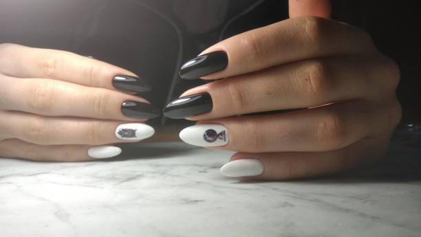 istock White gel polish with black design 1170934441