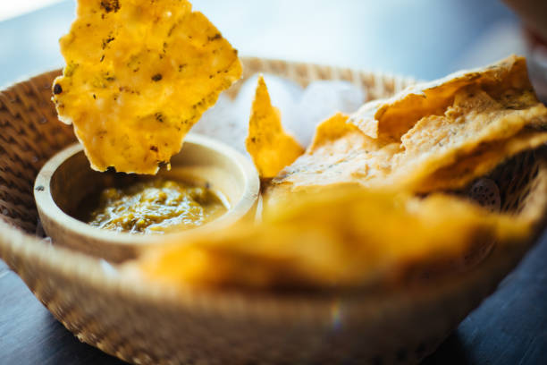 istock Nacho Chips and Guacamole on wooden table 1170935374