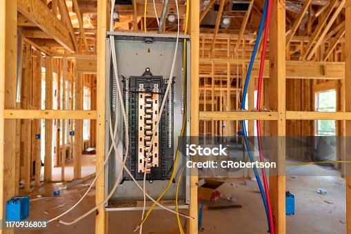 istock Electrical circuit breaker panel in new home under construction 1170936803