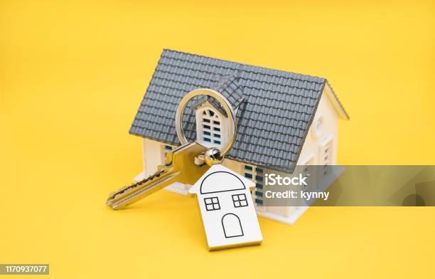 House Key And Key Chain On Yellow Background Stock Photo - Download Image Now - Key, Key Ring, Moving House