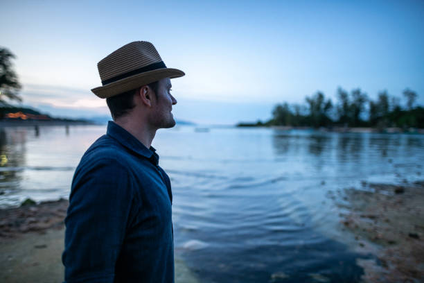istock Chilling out near swimming pool at sunset 1170938647